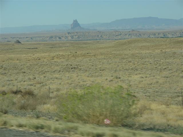 The Shiprock Butte rises 1,865 feet above the desert (#1067)