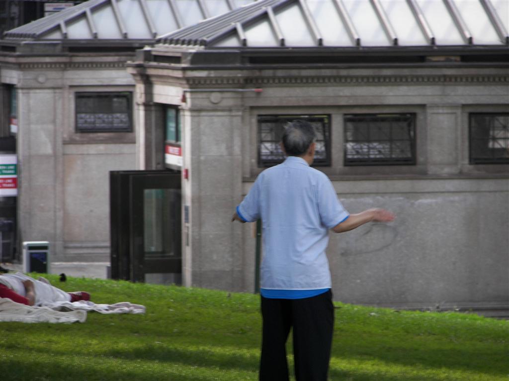 Old guy doing stretching exercises in Boston Common (#1985)